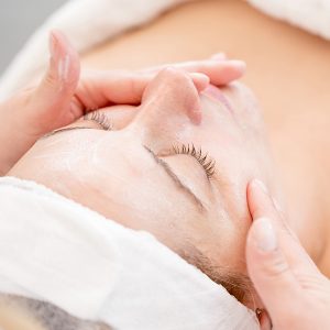 Professional facial massage using a cream