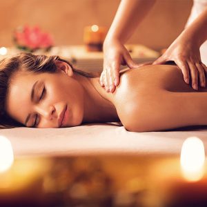 Relaxed woman gets a back massage from a professional